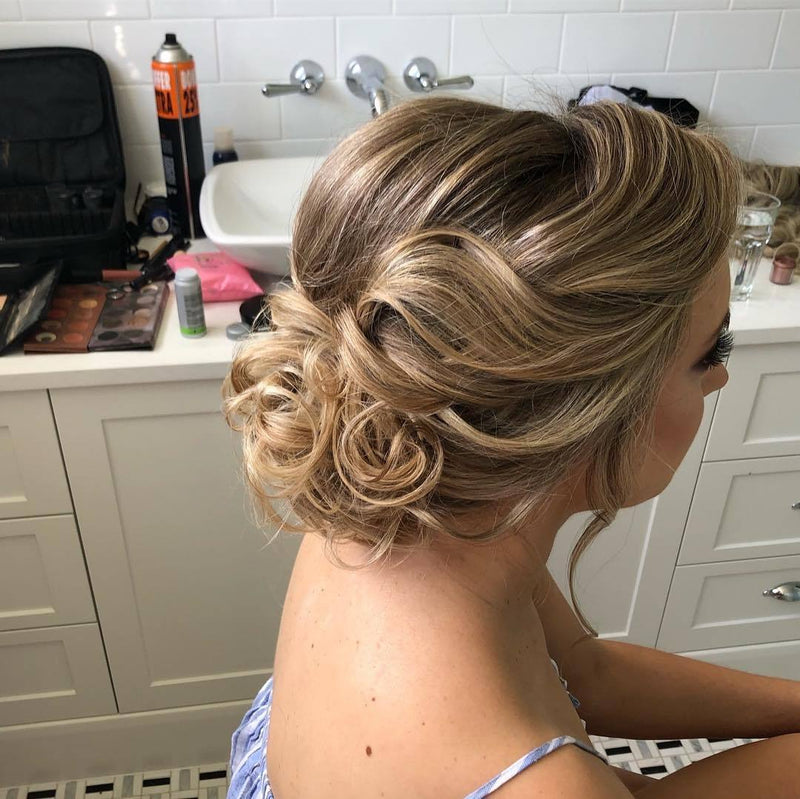 Bridal low messy bun hairstyle in Sydney